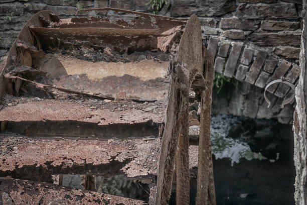 Rusty mill wheel in its traditional place in cutout. Close-up