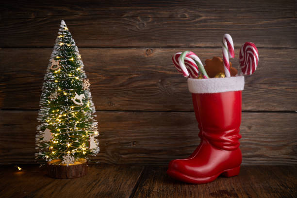 istock Santa boots with sweets and gifts for St. Nicholas Day on December 6th. 1355344531