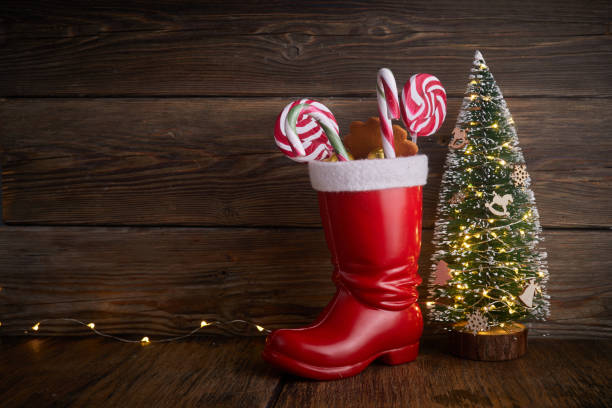 istock Santa boots with sweets and gifts for St. Nicholas Day on December 6th. 1355344557