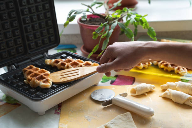 istock Preparation of croffle waffles. 1355344963