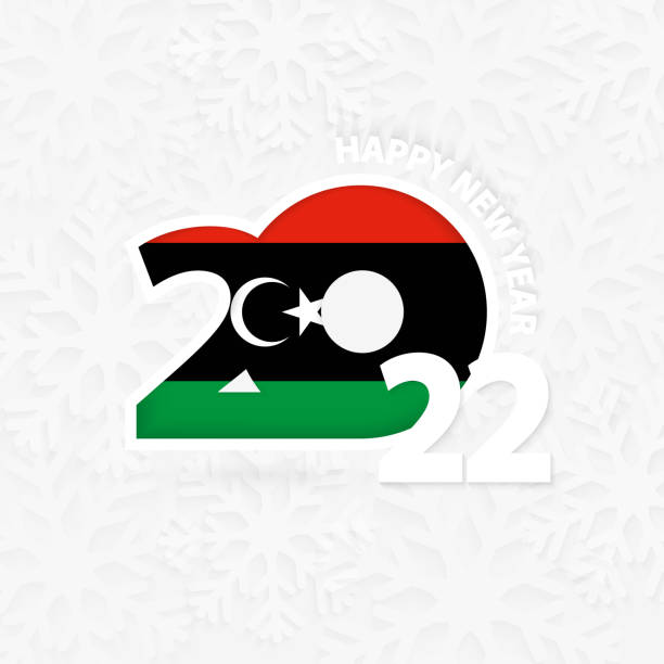szczęśliwego nowego roku 2022 dla libii na tle płatków śniegu. - libyan flag stock illustrations