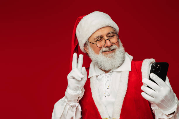 istock Happy, real, funny Santa Claus taking selfie 1355348857
