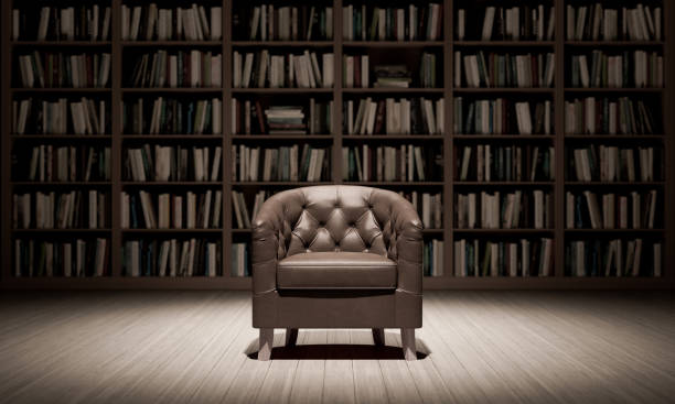 istock Leather armchair in the library with old books 3d render 1355353283
