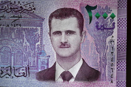 a portrait of Syrian President Bashar Al Asad on a current banknote