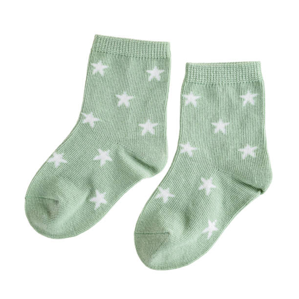 children's textile cotton soft socks green with a star pattern, warm woolen for kids, isolated on a white background stock photo