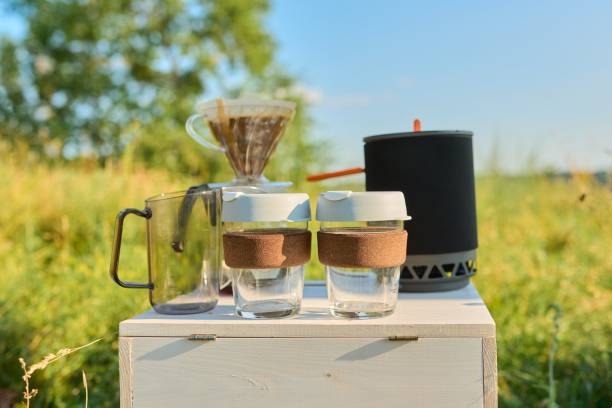 istock Camping coffee outdoor, preparation of natural coffee using grinder and maker 1355357668