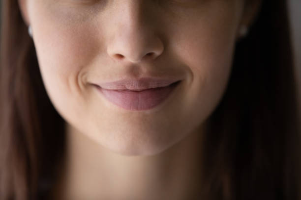 Crop close up beautiful young woman lips without makeup Crop close up of beautiful young woman mouth lips without makeup, lower face details, attractive female with healthy perfect clean smooth skin, lip balm, skincare and natural beauty concept closed mouth stock pictures, royalty-free photos & images