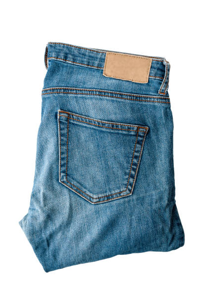 istock Denim jeans pants, folded, isolated on a white background, close 1355358109