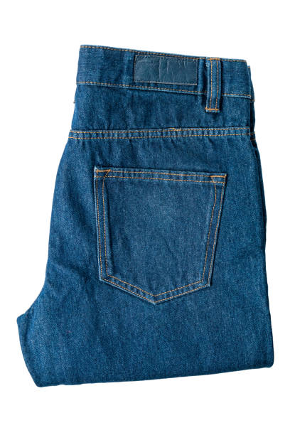 istock Folded jeans made of dark dense denim fabric, isolated on a white background, modern denim 1355358197