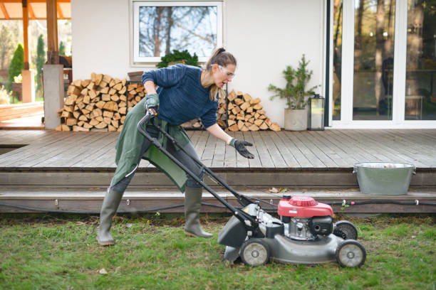 woman working in the garden ( lawn mower, breaking ) woman working in the garden vacation rental cleaning stock pictures, royalty-free photos & images