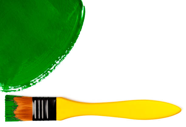 istock Paintbrush with green painted spot (isolated on white) 1355359536