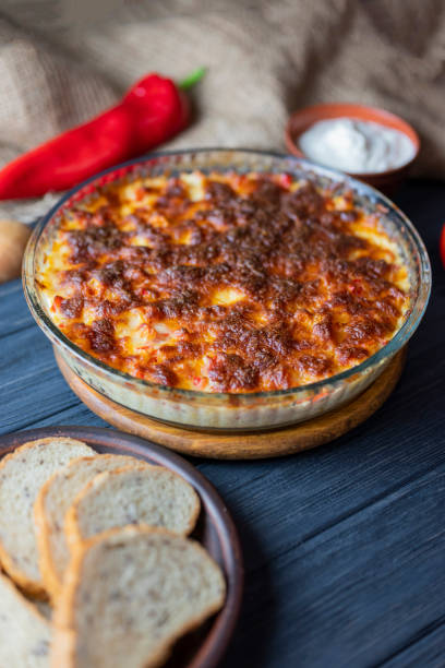 istock casserole lasagna dish with cheese baked on wooden background 1355364166