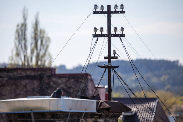 Cables and wires on an electric pole on the roof
