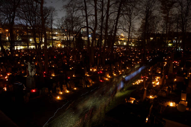Candles lit up on All Souls Day in Bernardine cemetery of Vilnius, Lithuania stock photo