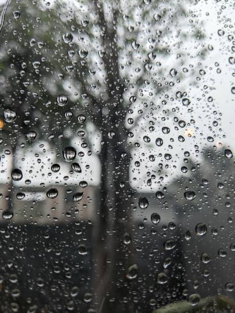 istock Closeup of Raindrops blur background 1355366744