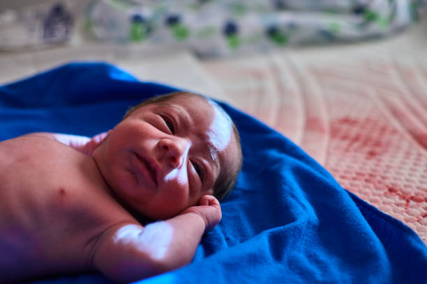 istock newborn with its umbilical cord 1355368505