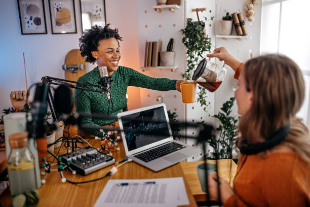 istock Young women recording podcast and drinking coffee 1355369845