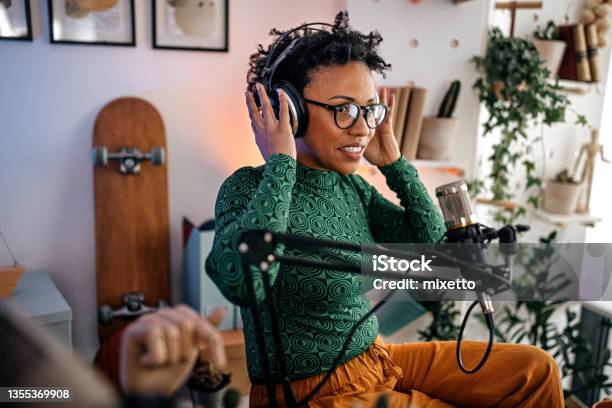 Woman Setting Headphones For Podcast Recording Stock Photo - Download Image Now - Podcasting, Radio Broadcasting, Radio