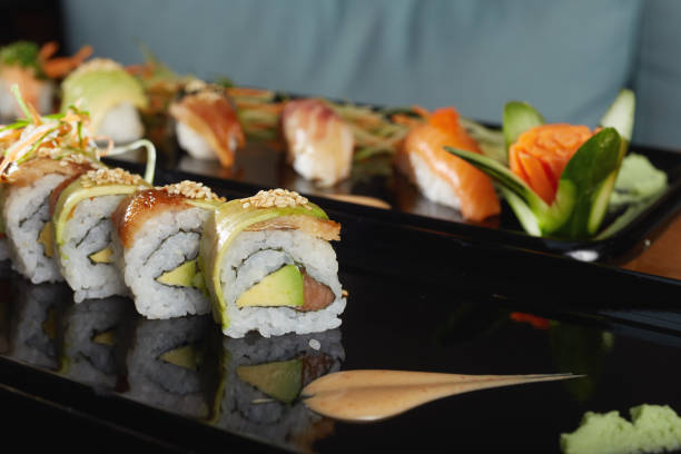 istock Various sushi on porcelain plate on table 1355370011