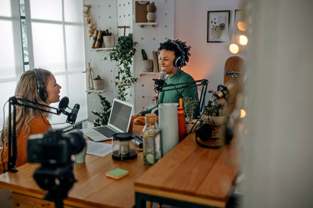 Two young women recording podcast