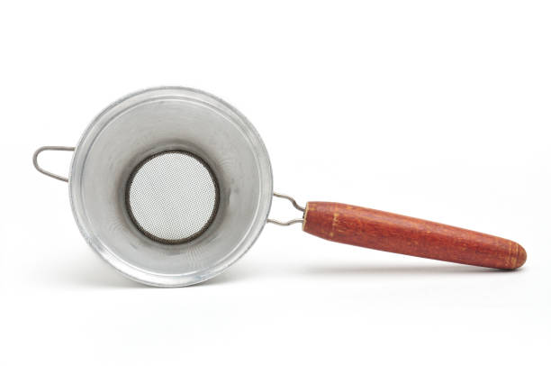 istock Vintage metal strainer for kitchen on white background 1355371136