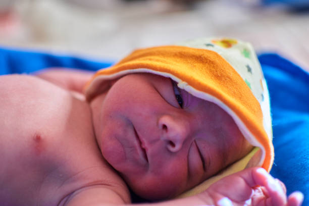 istock newborn with its umbilical cord 1355371468