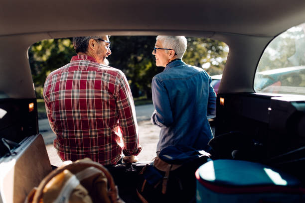 istock Mature couple on a road trip taking a break for refreshment 1355372347