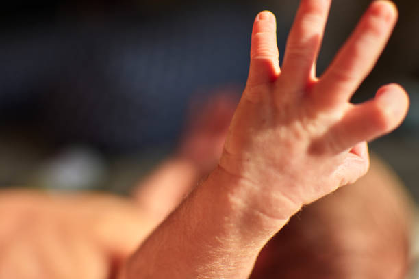 istock hand of a newborn 1355372926