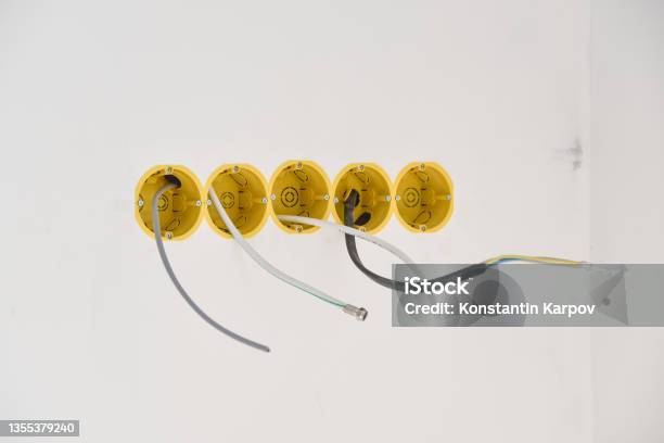 Installation Of Yellow Wall Sockets With Cable Stock Photo - Download Image Now - Cable, Box - Container, Image Montage
