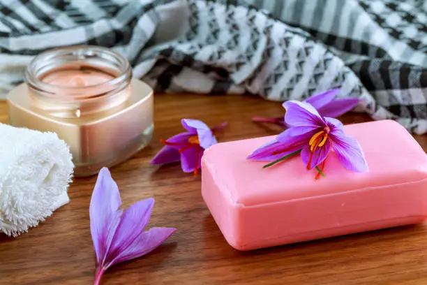 Saffron soap with saffron stigma. Crocus flowers. Saffron soap and cream. The use of saffron in cosmetology. Natural cosmetic.