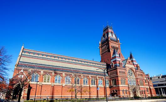 Cambridge, Massachusetts, USA - November 23, 2021: The high gothic Memorial Hall at Harvard University. Completed in 1877, it is a monument to the memory of graduates who fought for the Union cause in the Civil War. Today it is a National Historic Landmark.