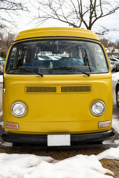 Classic vintage yellow Volkswagen Transporter camper van parked in Portsmouth NH, USA