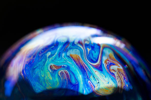 istock Abstract pattern, multicolored chaotic texture inside of the soap bubble, closeup 1355403326