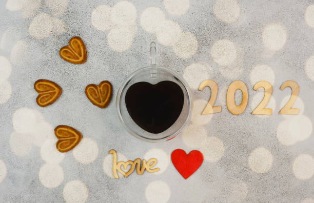 istock valentines day background with copy space text, festive holiday flat lay with cup coffee drink in glass material top view shape heart, love breakfast concept 1355406967