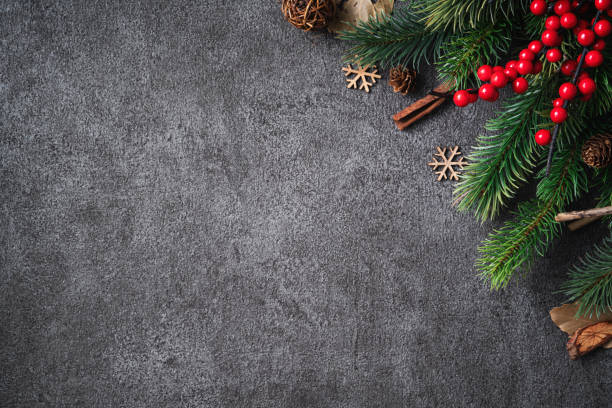 istock Christmas background design concept with fir tree branch border frame. 1355408389