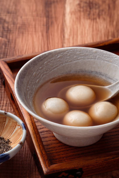 istock Sesame big tangyuan with syrup soup. 1355408487