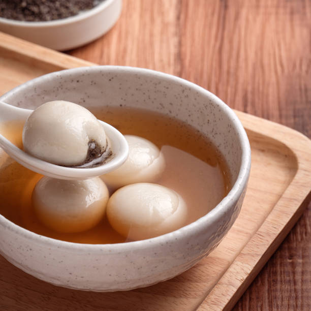 istock Sesame big tangyuan with syrup soup. 1355408491