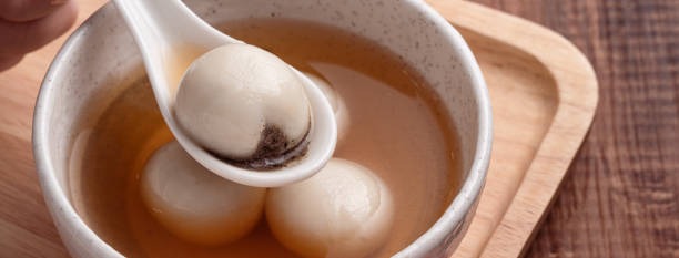 istock Sesame big tangyuan with syrup soup. 1355408512