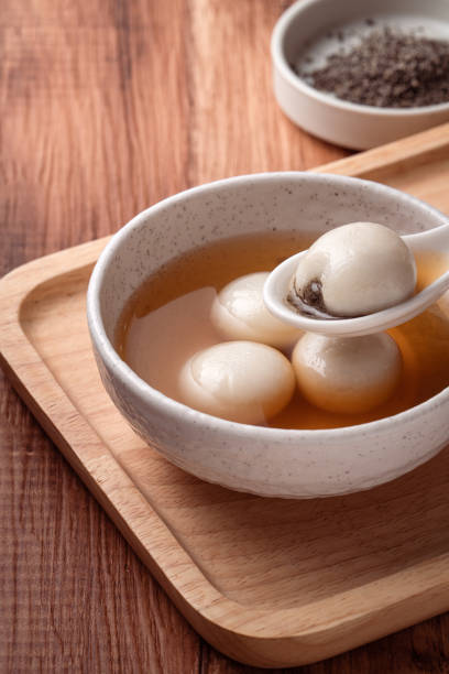 istock Sesame big tangyuan with syrup soup. 1355408571