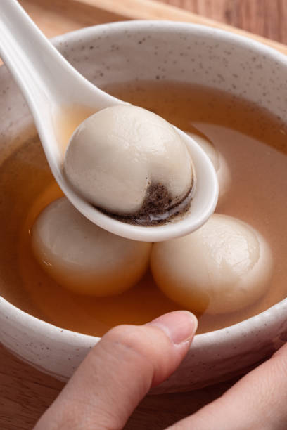 istock Sesame big tangyuan with syrup soup. 1355408745