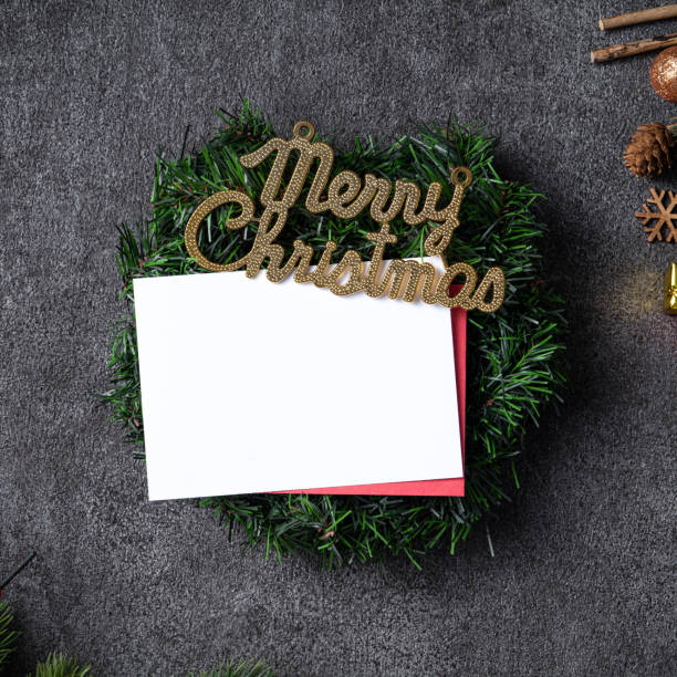 istock Christmas background design concept with fir tree branch border frame and blank card. 1355408805