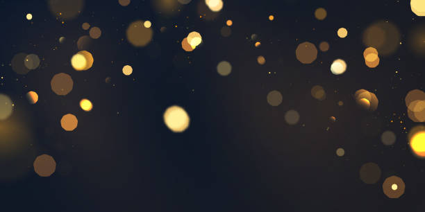 istock Beautiful golden glitter stars on abstract black background are used for celebrations. 1355412228