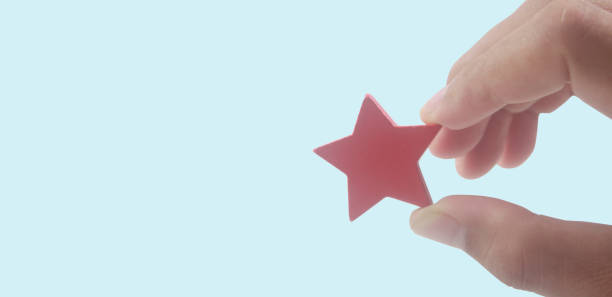 istock Rise on increasing stars in human hand, Increase rating 1355415762