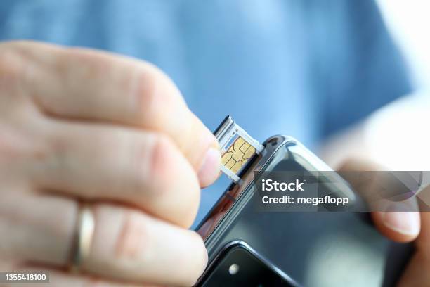 Male Hands Getting Sim Card Slot Of His Smartphone Out Stock Photo - Download Image Now