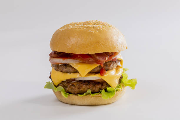 istock hamburger with vegetables and cheese on white background 1355421082