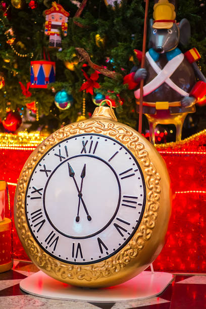 istock Clock twelve o'clock at night on a Christmas background. New Year 1355422164