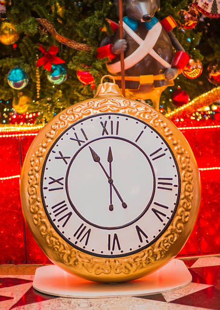 istock Clock twelve o'clock at night on a Christmas background. New Year 1355422168