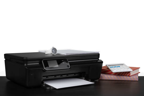 istock Office table with laser printer and books against white background 1355424356