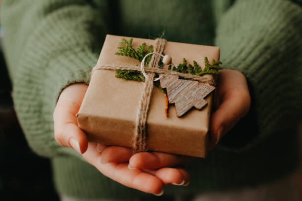 istock Female hands holding nice gift box. Close up 1355425464