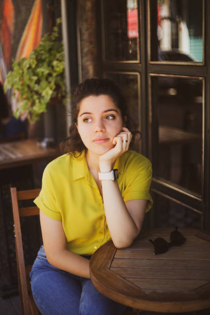 istock Girl at cafe shop 1355426107